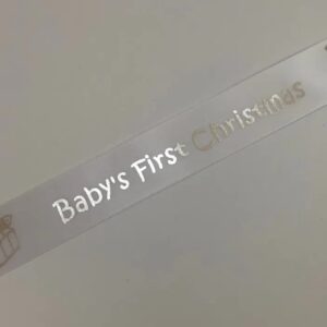 Baby's first Christmas printed on white, Pink or Blue satin ribbon with silver 25mm x 1m