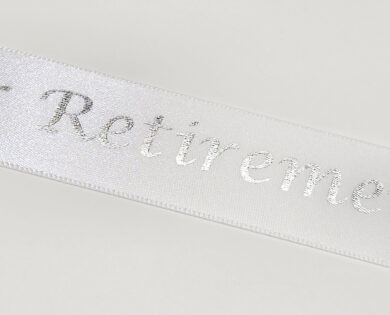 On Your Retirement white satin ribbon with a silver metallic print 25mm x 1m